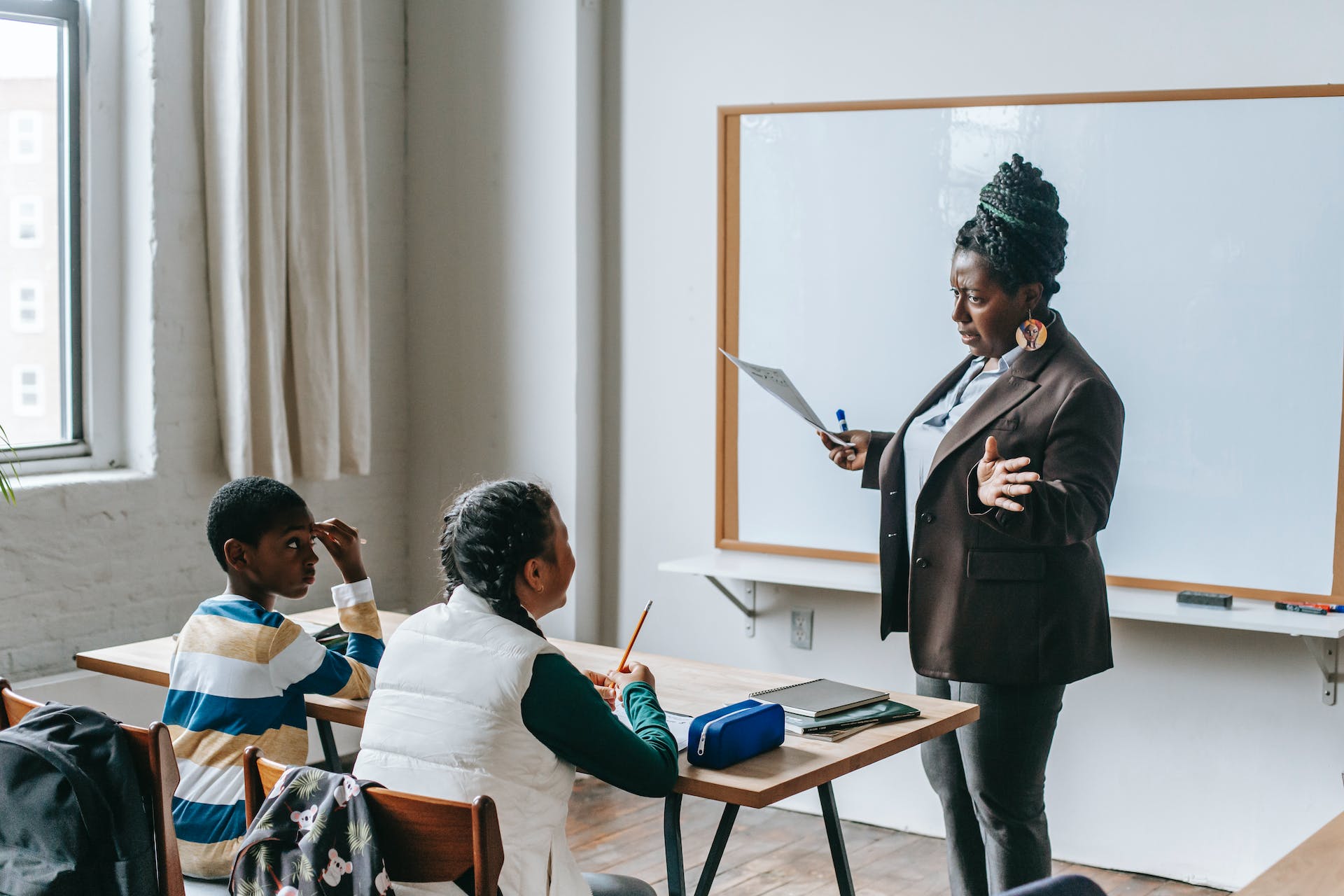 Teacher instructing students in classroom